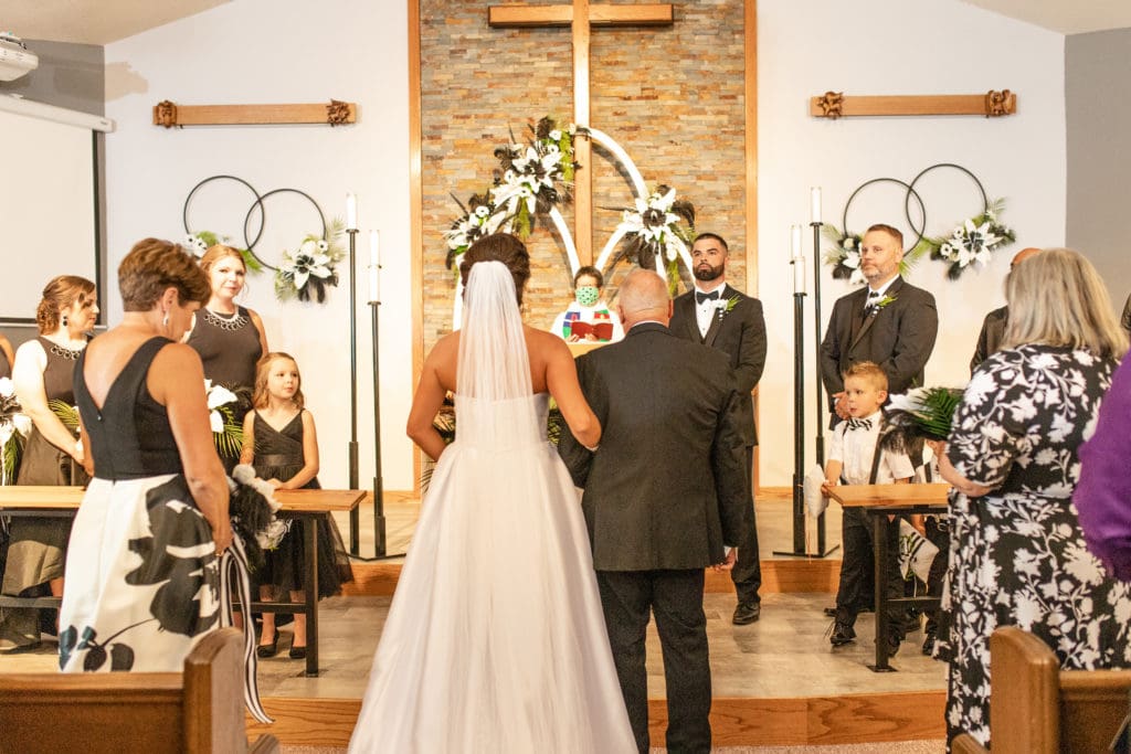 bride and groom at altar, bride and groom say i do, Lutheran wedding, Lutheran church