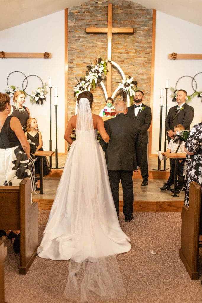 bride and groom at altar, bride and groom say i do, Lutheran wedding, Lutheran church