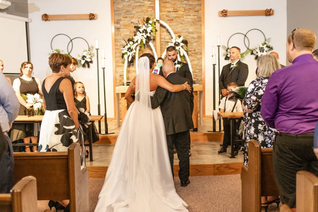bride and groom at altar, bride and groom say i do, Lutheran wedding, Lutheran church