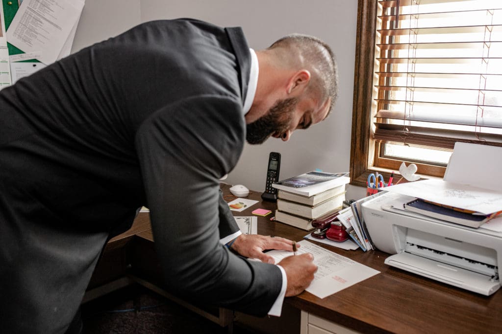 groom signing the marriage license