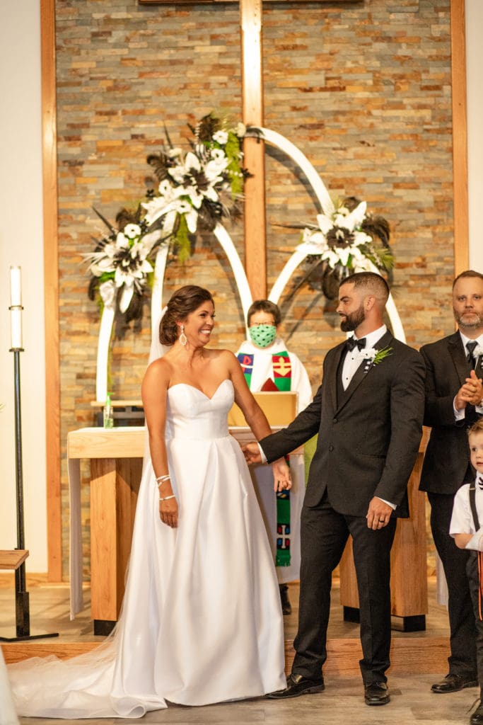 pronounced husband and wife, Lutheran church wedding, black and white decorations